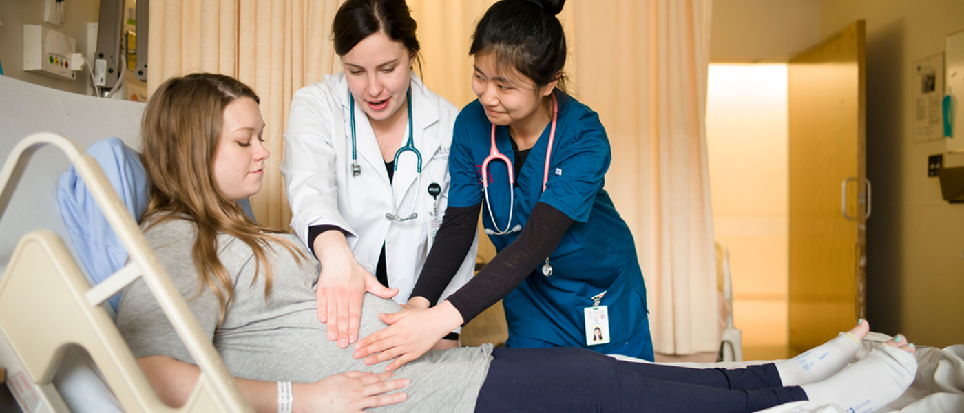 Health practitioners examining a patient
