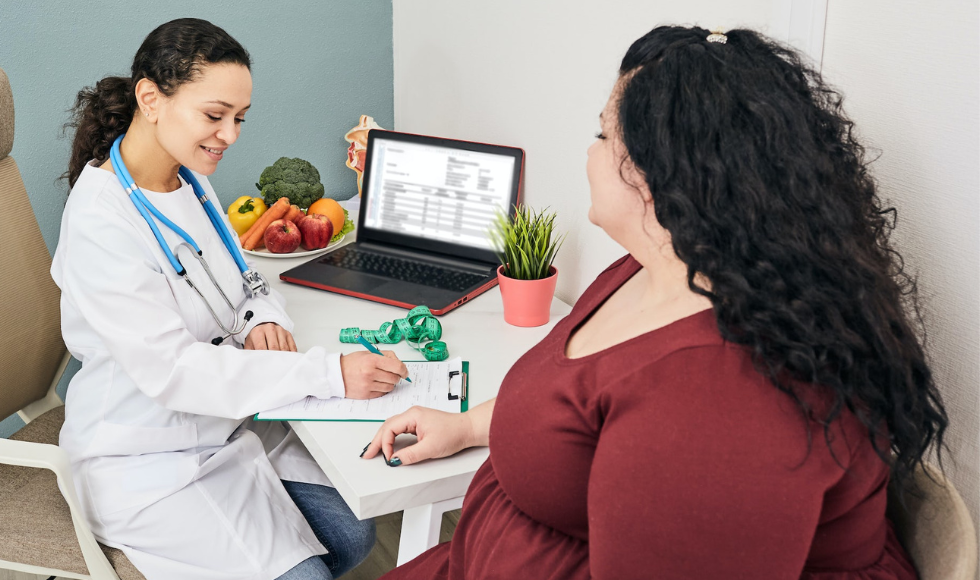 a physician and patient have a conversation regarding obesity