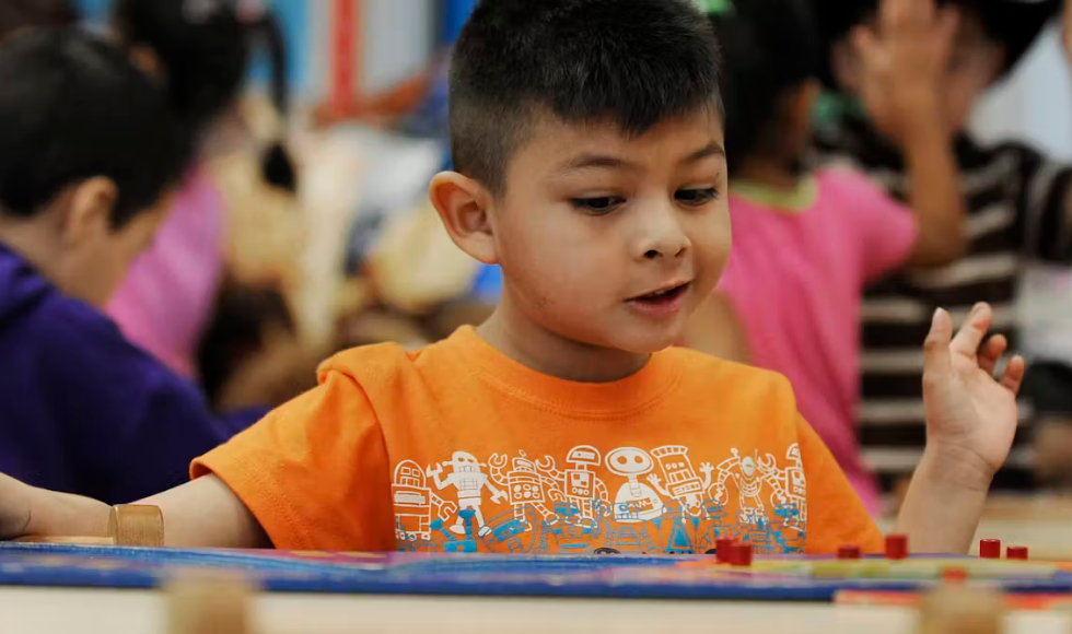 A child plays with a puzzle in pre-kindergarten at Lion Lane School in Houston, Texas, in 2012. (AP Photo/Pat Sullivan)