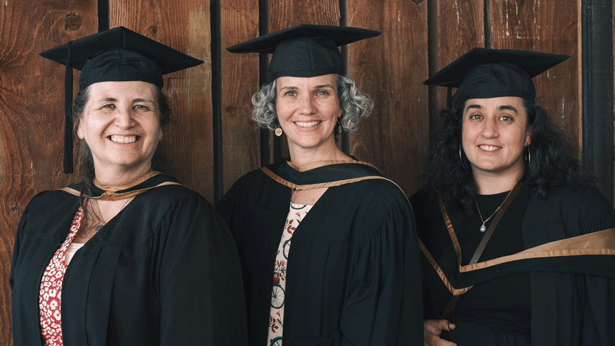 Lynne-Marie Culliton, Rebecca Hautala, and Claire Portigal can be seen wearing graduation gowns at the Spring 2024 Faculty of Health Sciences Convocation.