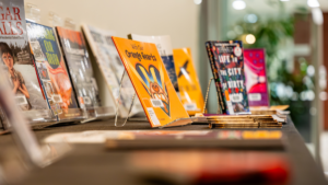 A close-up of the book: With Our Orange Hearts by Phyllis Webstad, which is sitting on the Health Sciences Library's curated collection of books for National Day for Truth and Reconciliation.