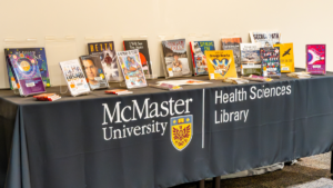 Full table display of the Health Sciences Library's curation collection of books, in recognition of National Day for Truth and Reconciliation.