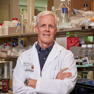 A headshot of Eric Brown, the expert featured in this story. He is posing with arms-crossed in his laboratory.