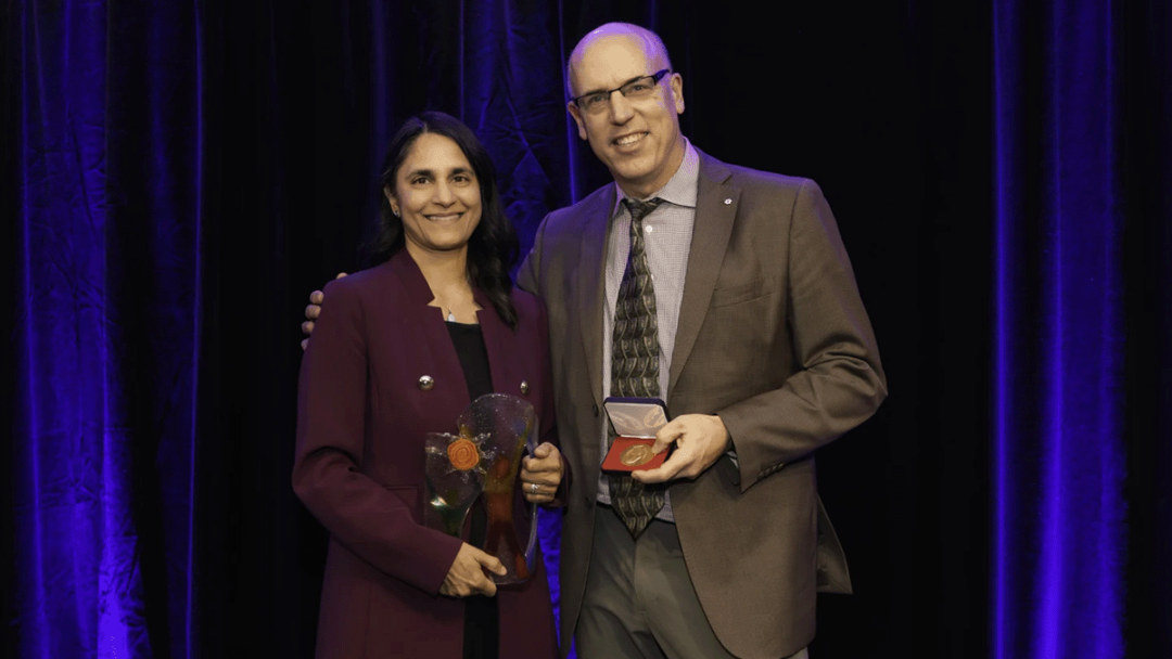 Sonia Anand can be seen receiving an award from the Health Research Foundation.