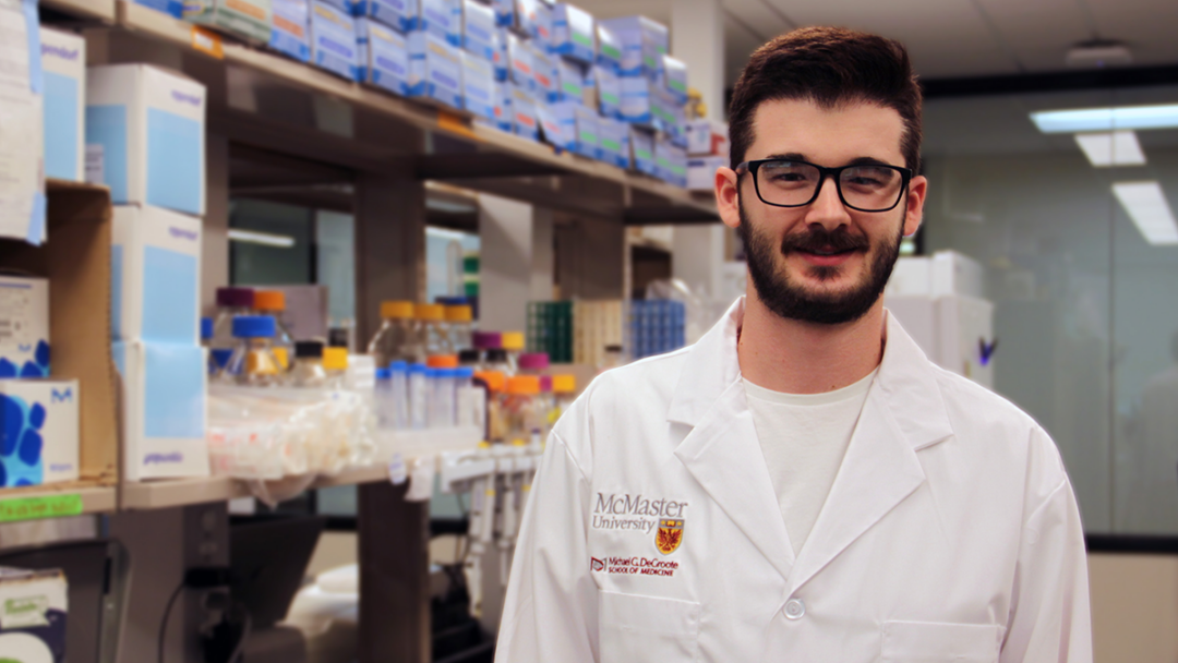 Stephen Garrett, the learner featured in this story, posing in a McMaster laboratory.