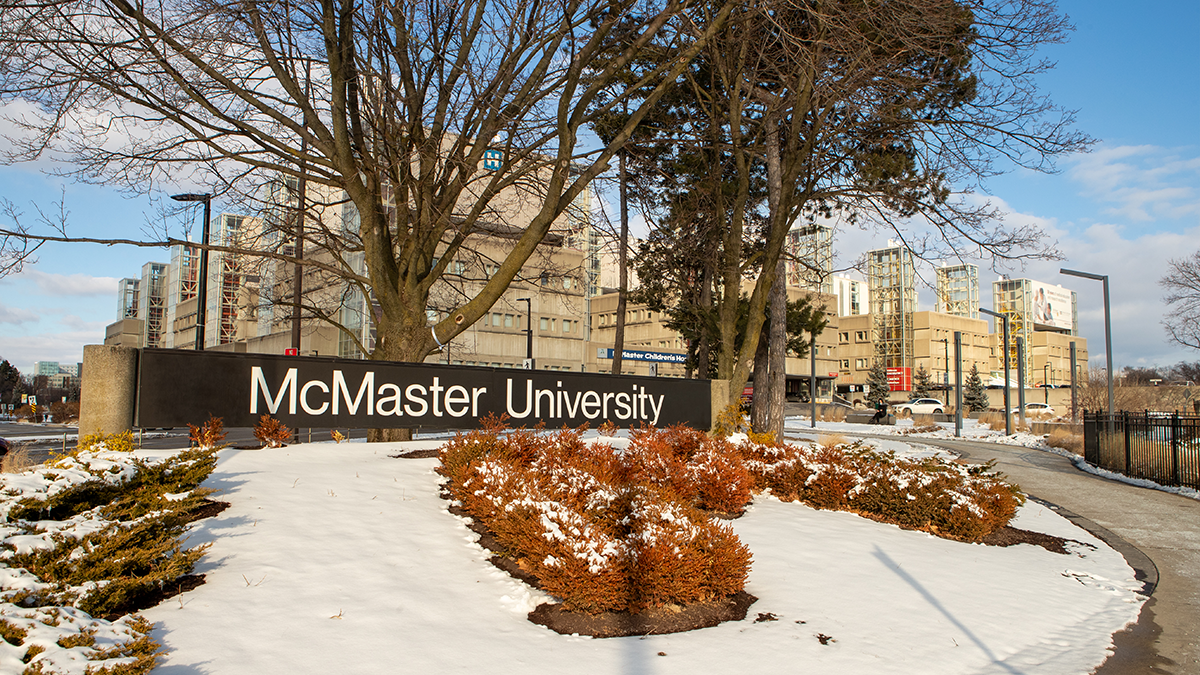 McMaster University sign outside of the Health Sciences Centre with snow.