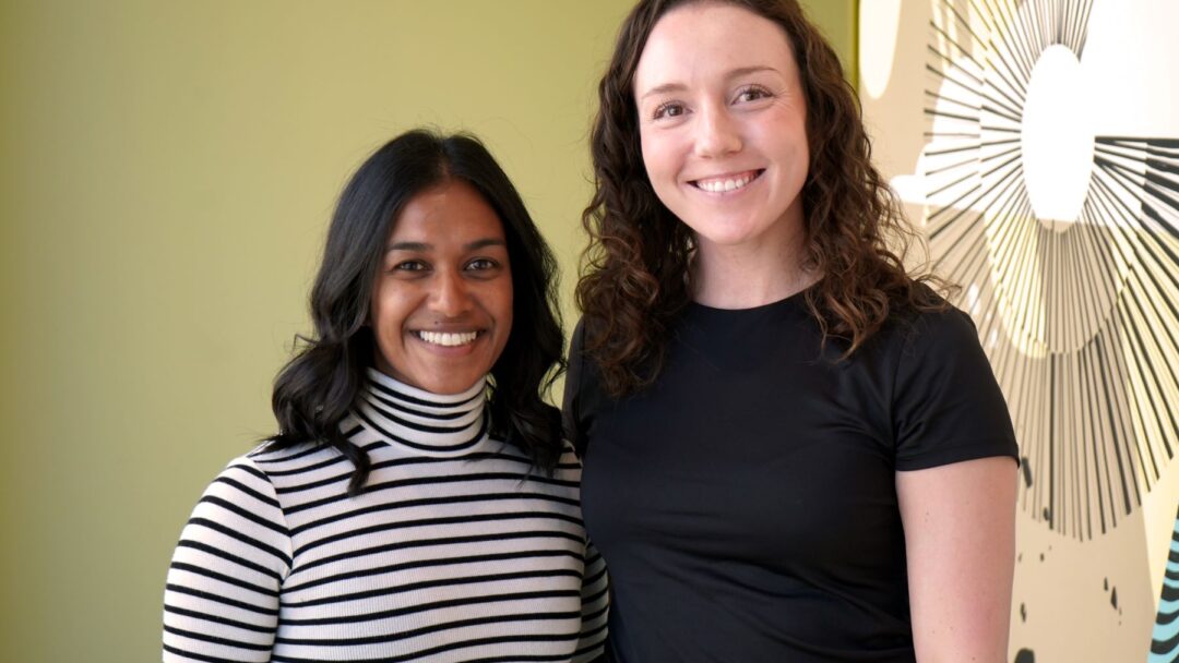 Shayna Henry and Brooke Hoffman pose together and smile for the camera.